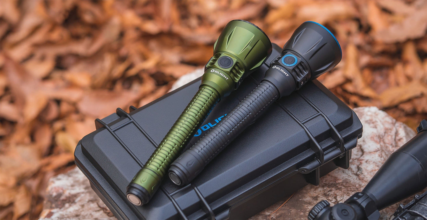 Olight Javelot Turbo 2 with holster resting on the ground outdoors