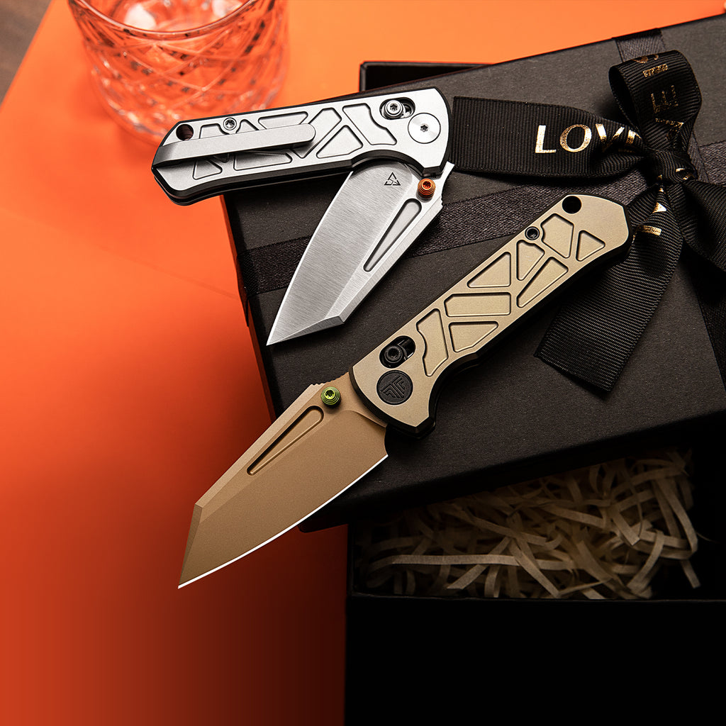TRIVISA tactical folding knife with modified tanto blade and titanium handle