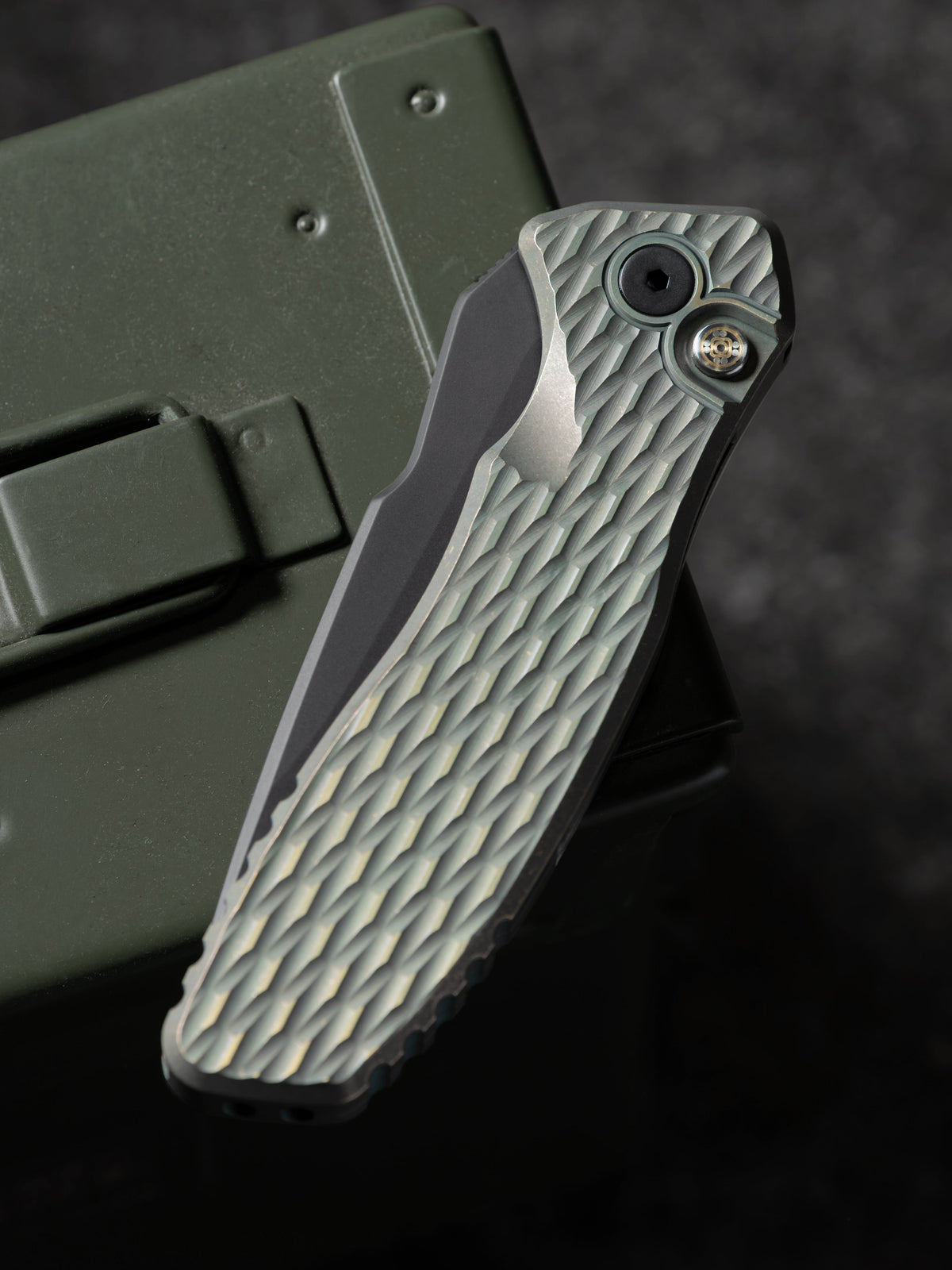 Pro-Tech Pallas 2026 Custom 007 closed view showing distressed green/gold anodized Lattice titanium handle