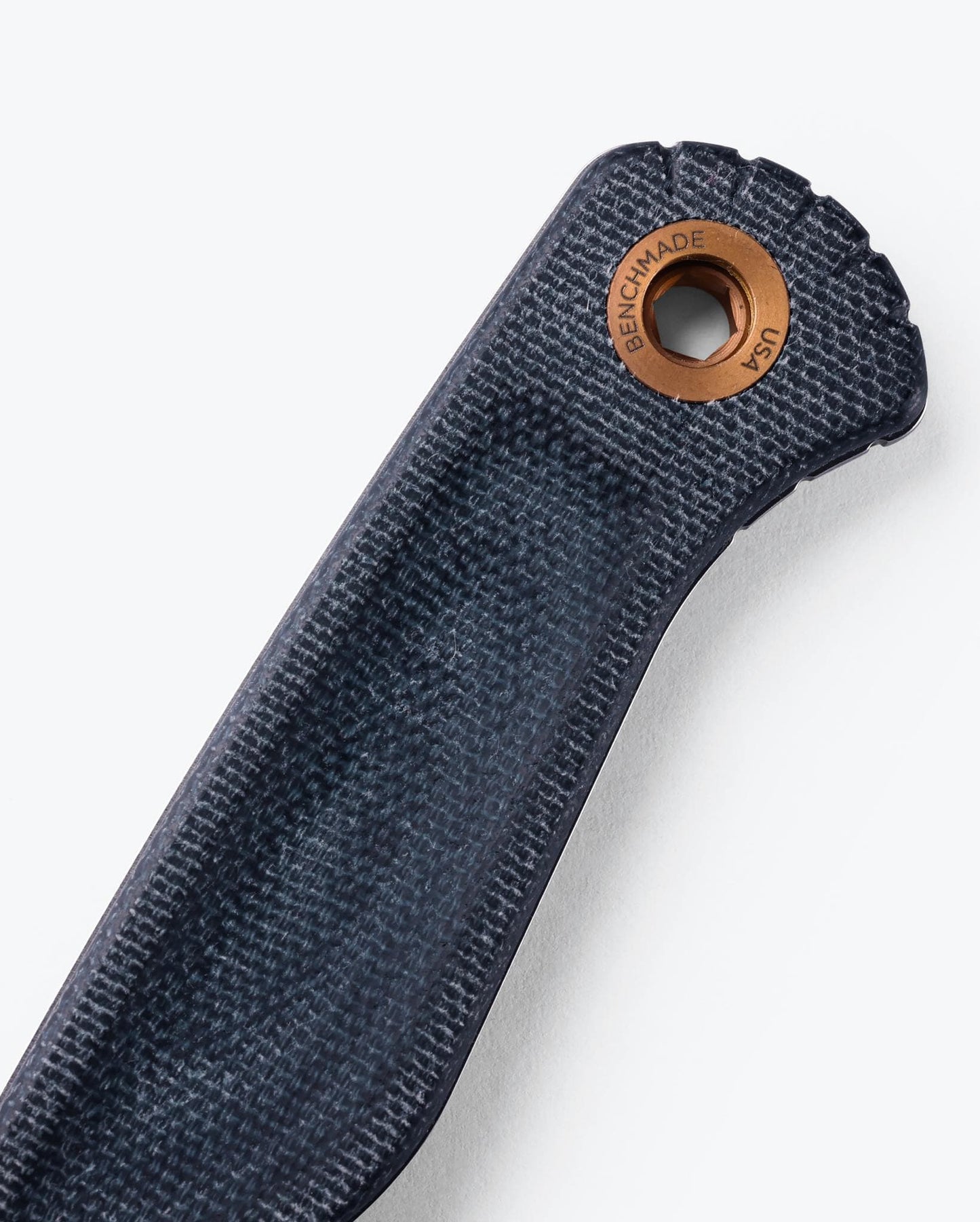 Benchmade Dacian 203-04 Blue Denim Micarta handle and copper lanyard hole detail