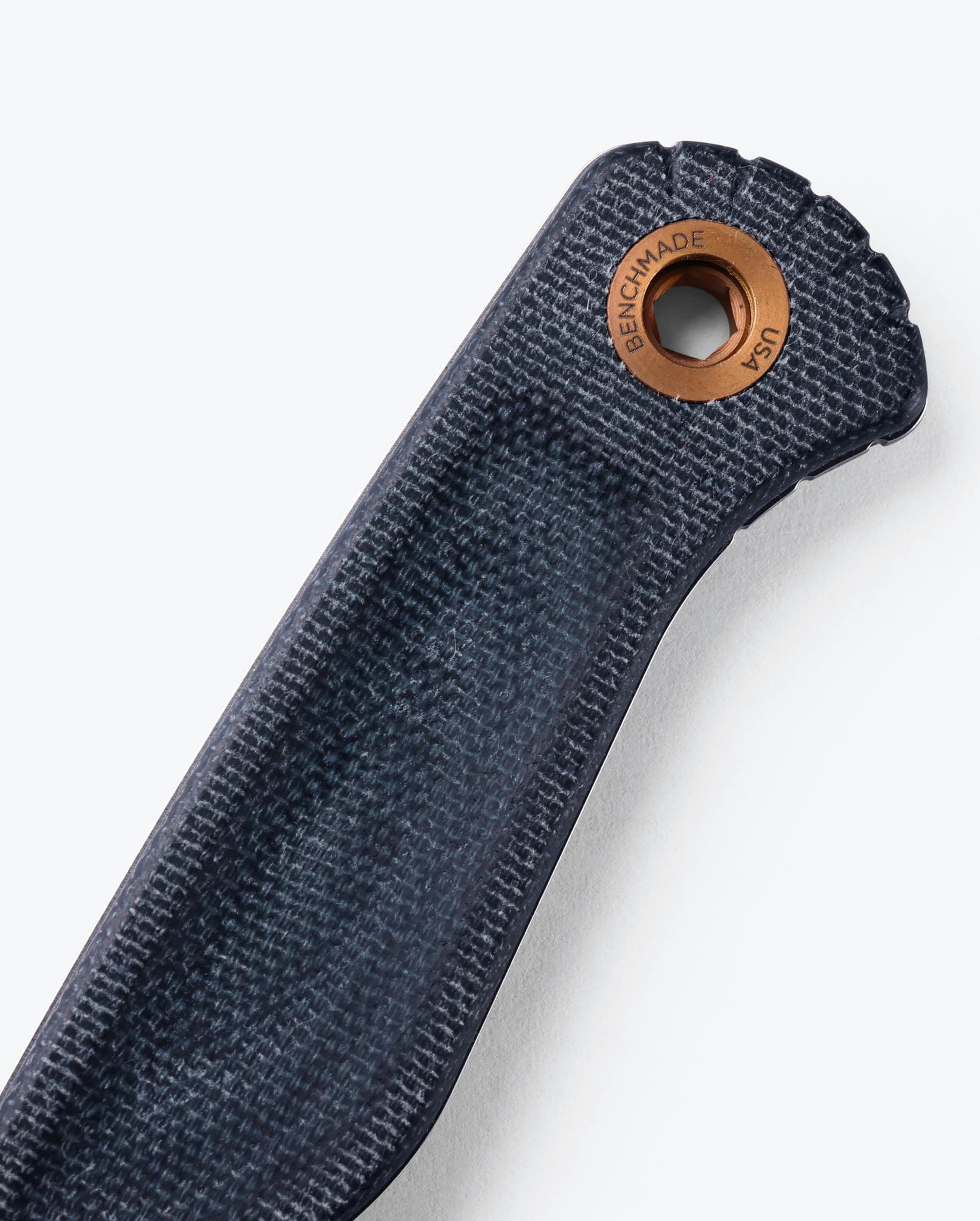 Benchmade Dacian 203-04 Blue Denim Micarta handle and copper lanyard hole detail