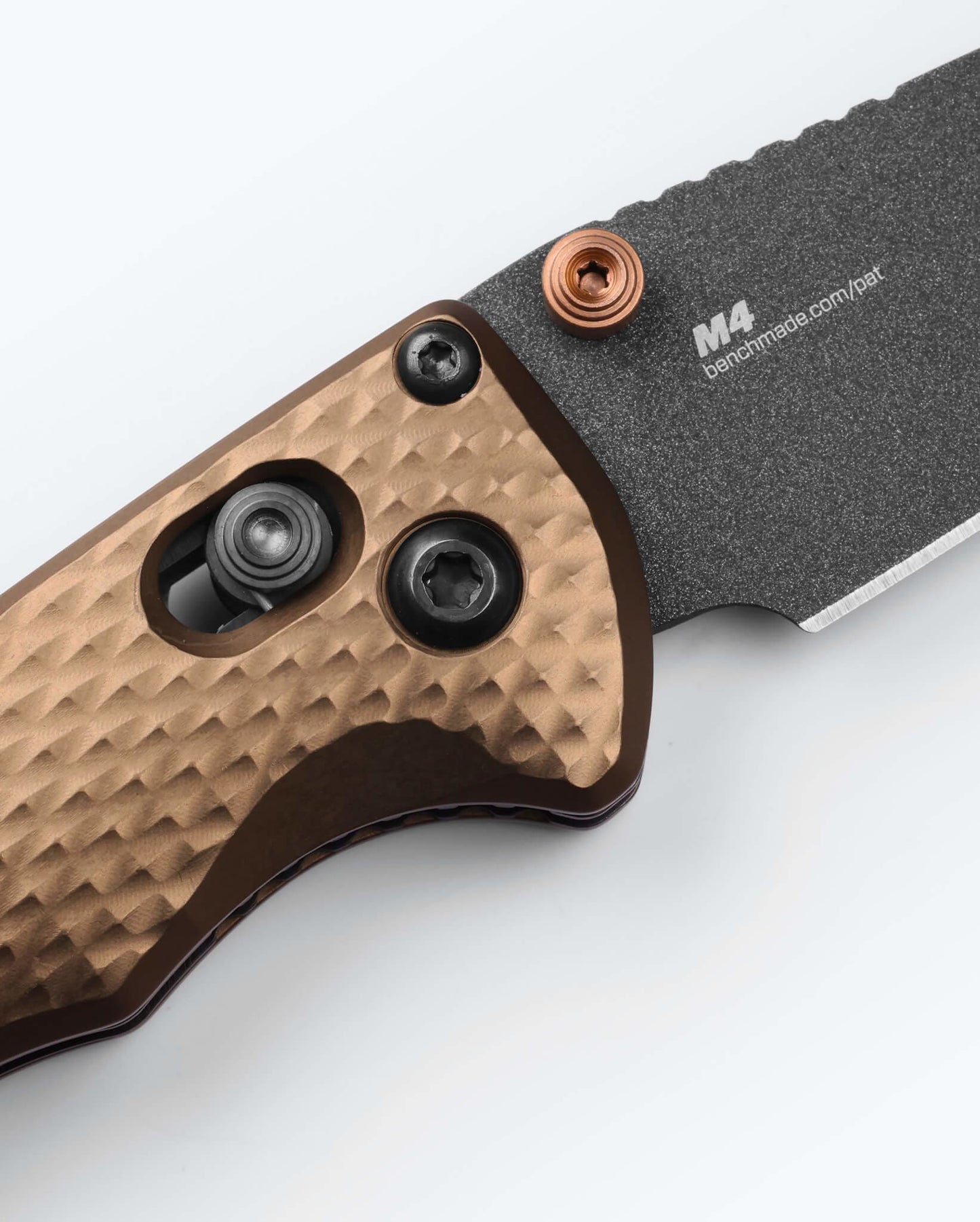 Benchmade Full Immunity 290BK-1 Flat Dark Earth dimpled aluminum handle scales and AXIS lock detail with CPM-M4 blade marking