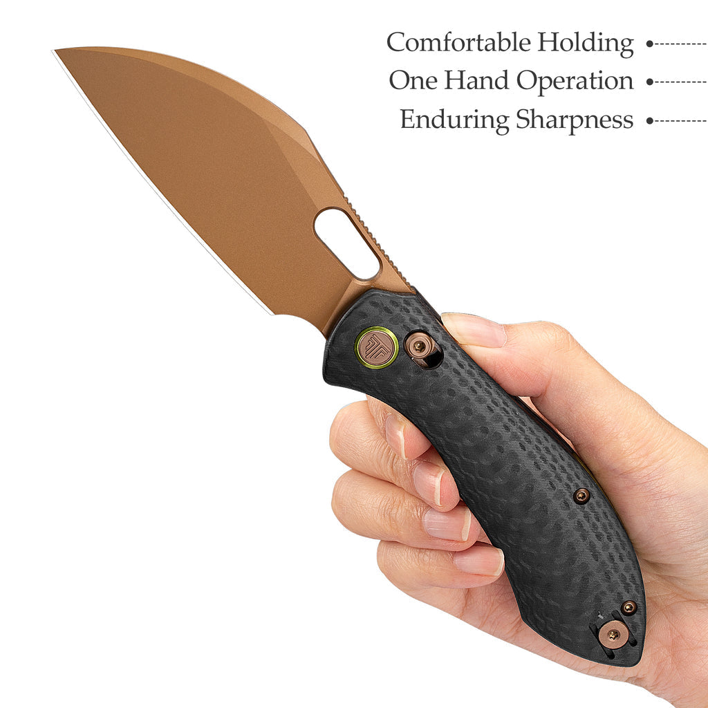 Bronze sheepfoot blade with black handle and pocket clip for outdoor use