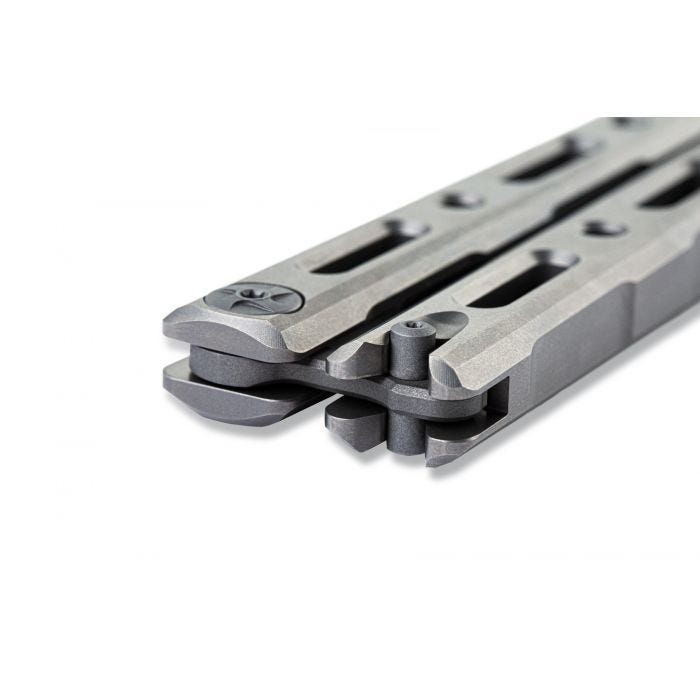 Benchmade 85 Billet Ti Bali-Song closed angled view showing tang and titanium handle ends