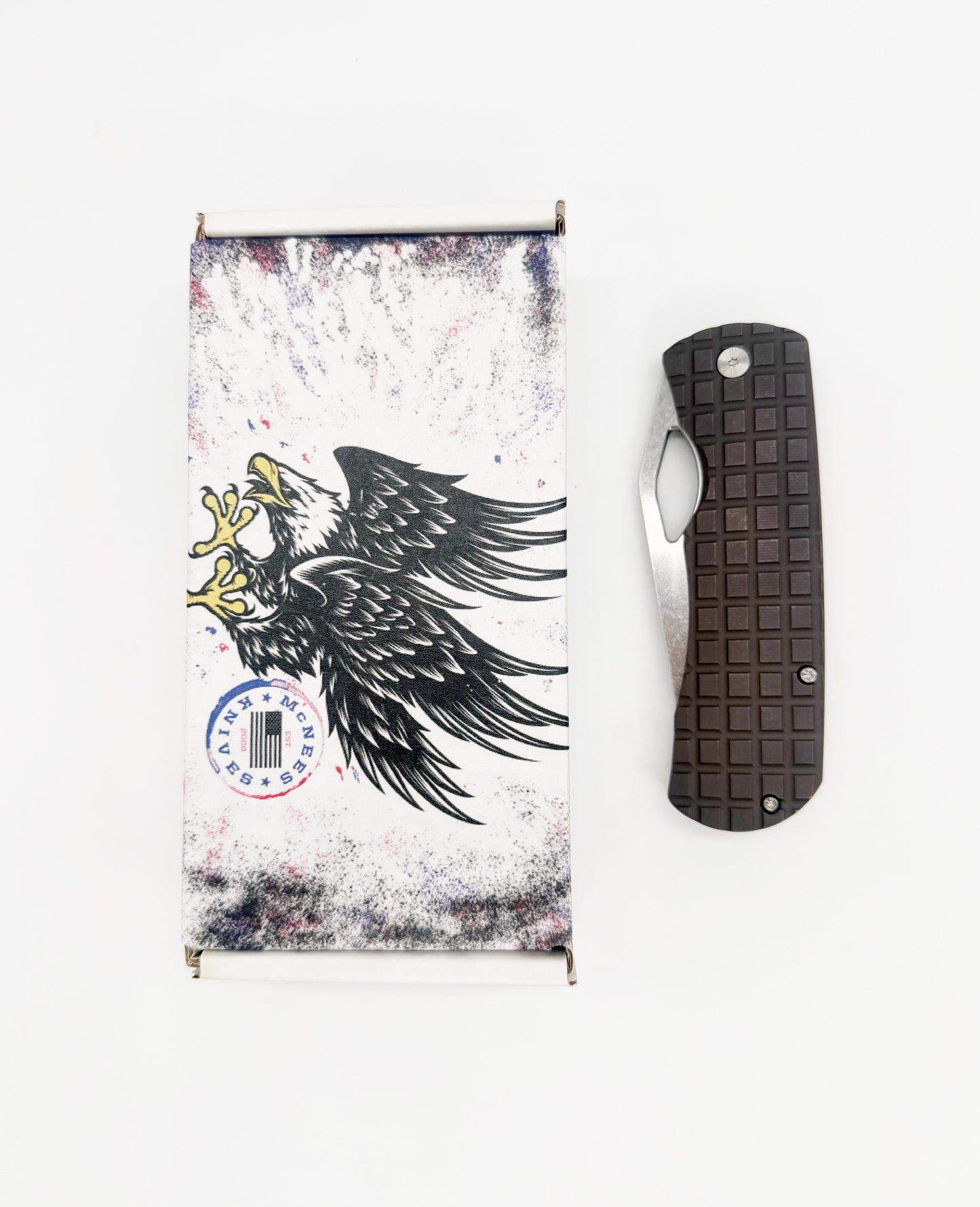 McNees Knives Dixon 3.75 inch MagnaCut knife with bronze handle and blade, displayed with packaging