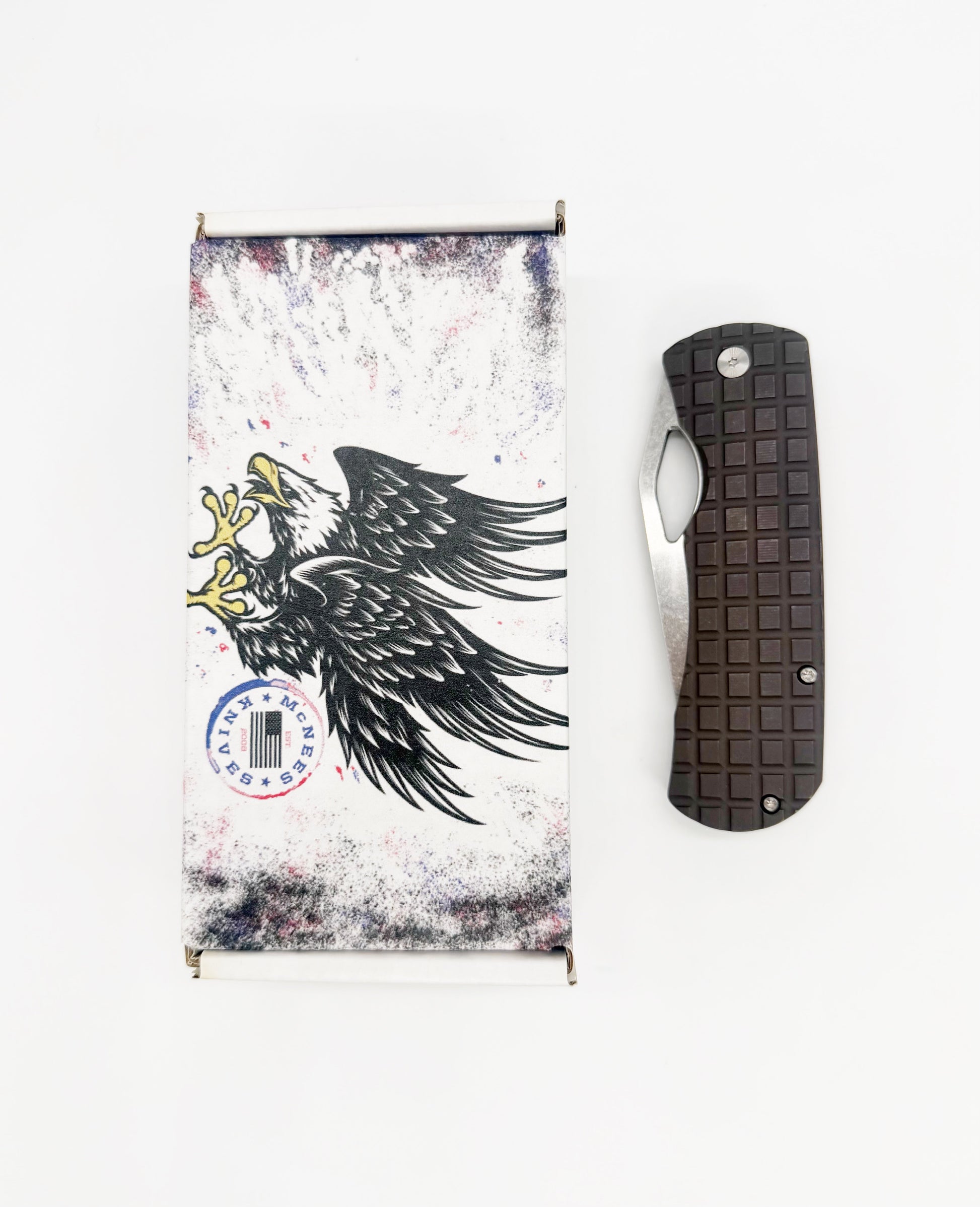 McNees Knives Dixon 3.75 inch MagnaCut knife with bronze handle and blade, displayed with packaging