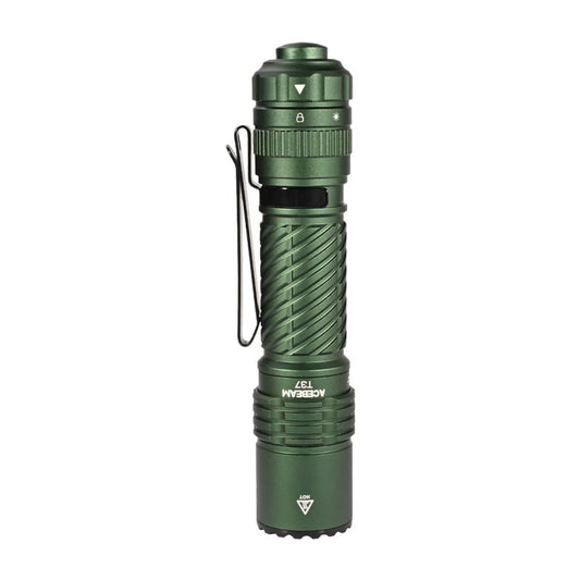 Dark green tactical flashlight with clip and textured grip