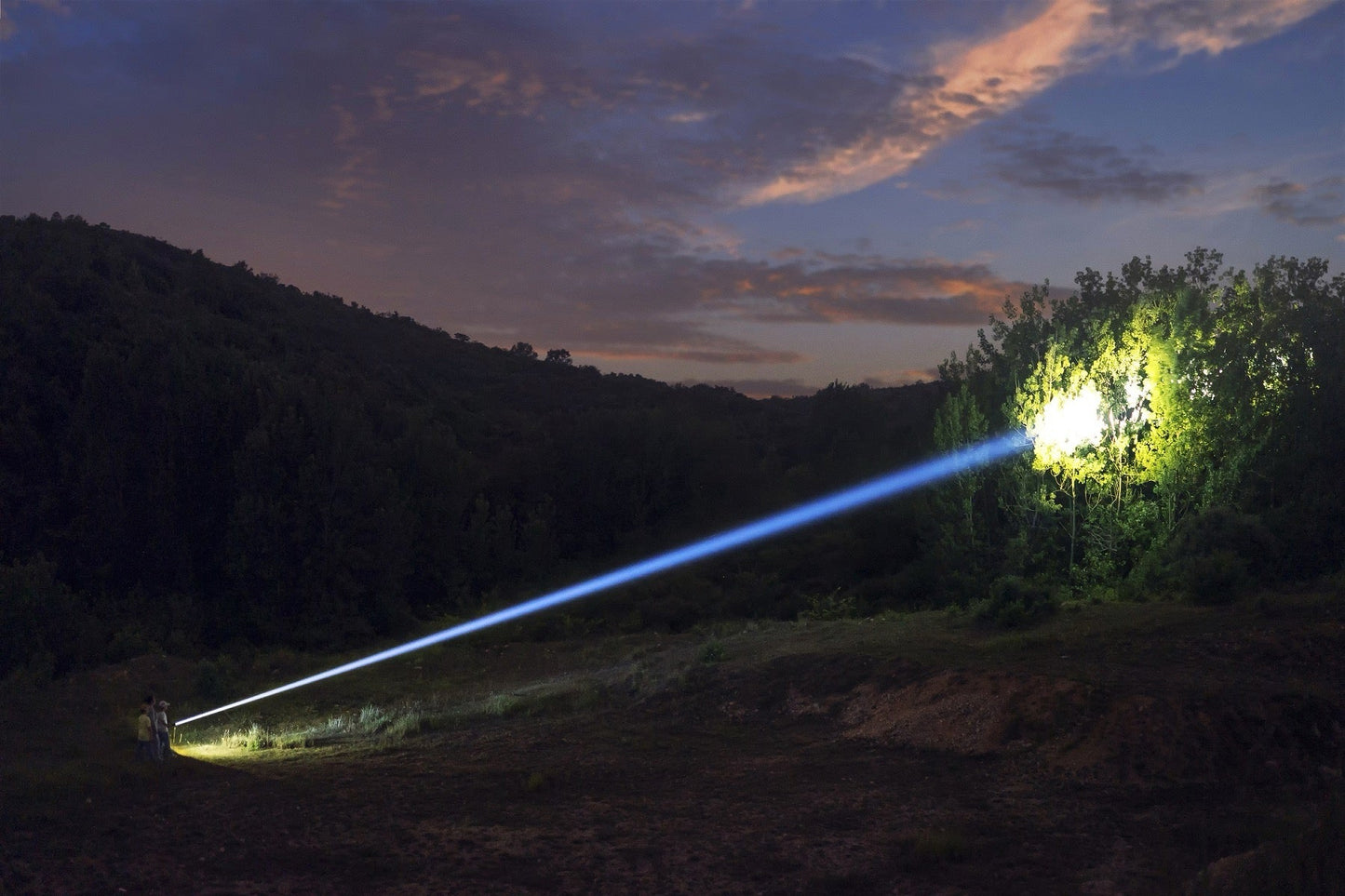 Weltool W5R Pro long-range LEP flashlight in hand size reference