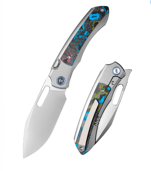 Remette RT-Orca ORCAUR – 3.15″ Pearlescent M390 Drop Point, Titanium & Ultimate Warrior CamoCarbon, Button Frame Lock