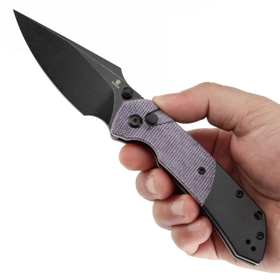 Tenable Fenrir T1034S5 in hand showing frag-pattern grip and ergonomics