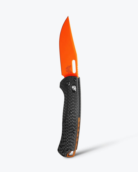 Benchmade Mini Taggedout 15533OR-01 front view – 3″ CPM-MagnaCut clip point folding hunting knife, carbon fiber
