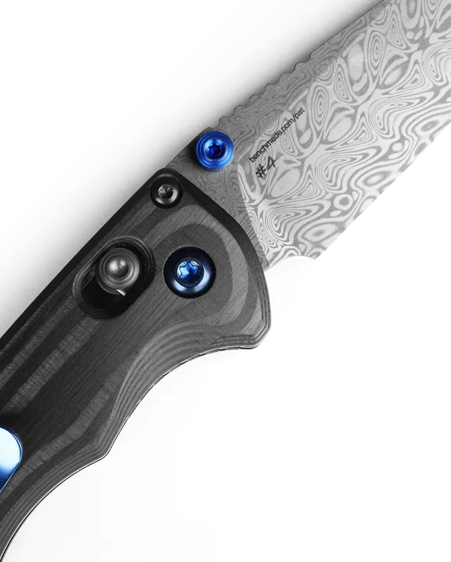 Benchmade Gold Class Full Immunity 290-241 detail - etched Aegir Damasteel pattern and AXIS lock with sapphire blue accents