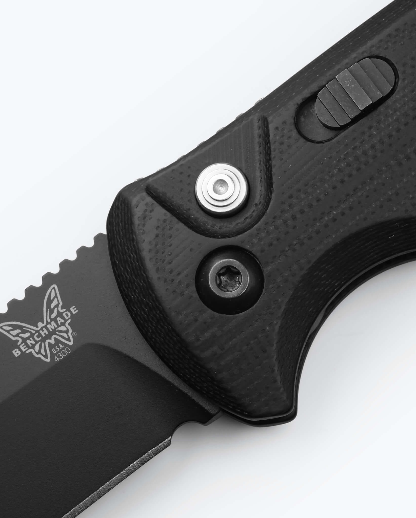 Benchmade CLA 4300 black G10 handle and actuation button detail