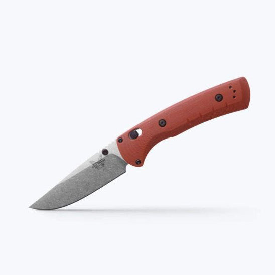 Folding knife with red handle and gray blade