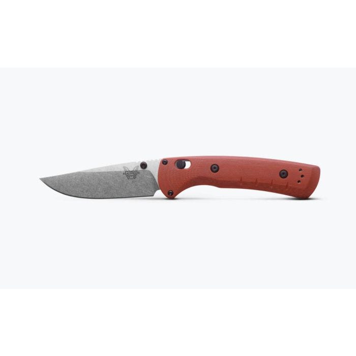 Side view of folding knife with red handle and gray blade