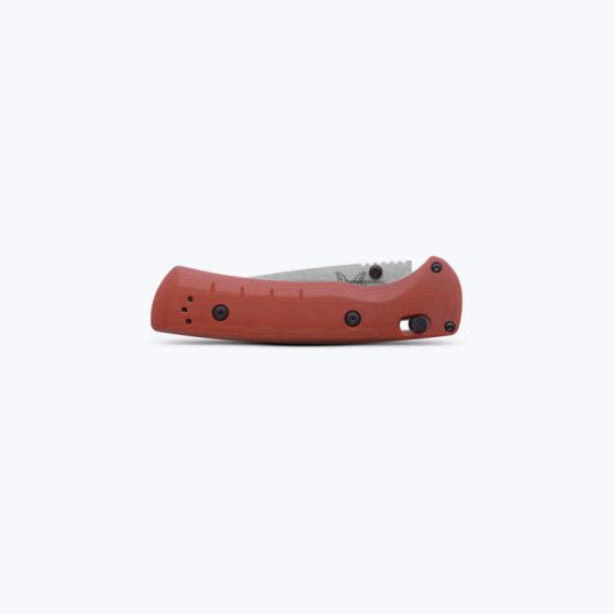 Red handle folding knife with closed blade