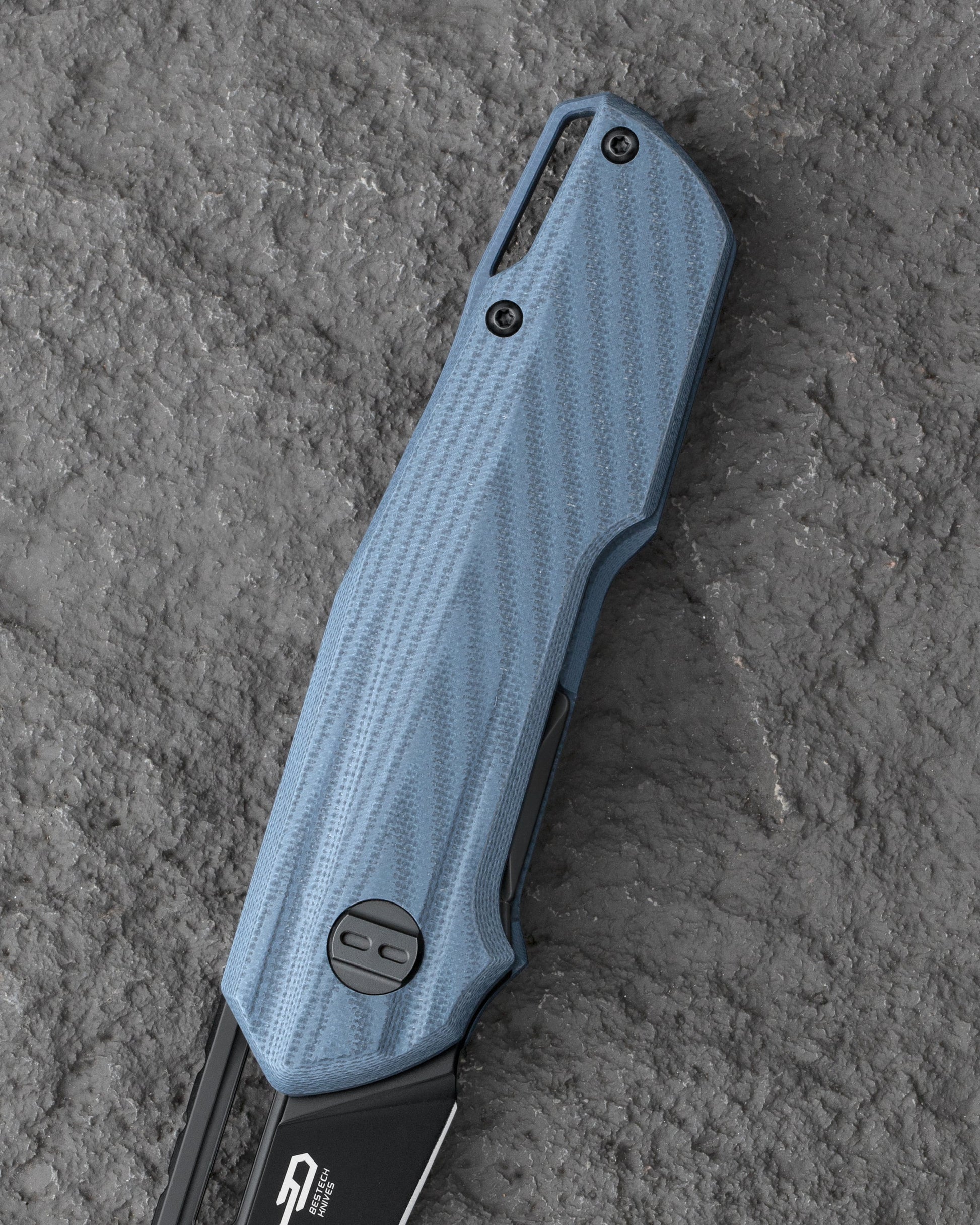 Bestech Toddler BG64E handle detail – blue G10 texture, liner lock mechanism