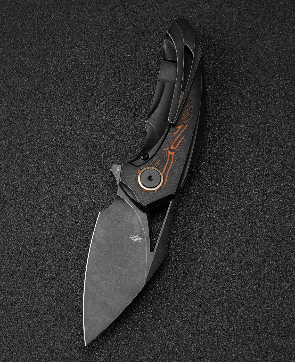 Bestech Nuke BT2107E closed view – 4.05 inch closed, black titanium frame with orange G10 inlays