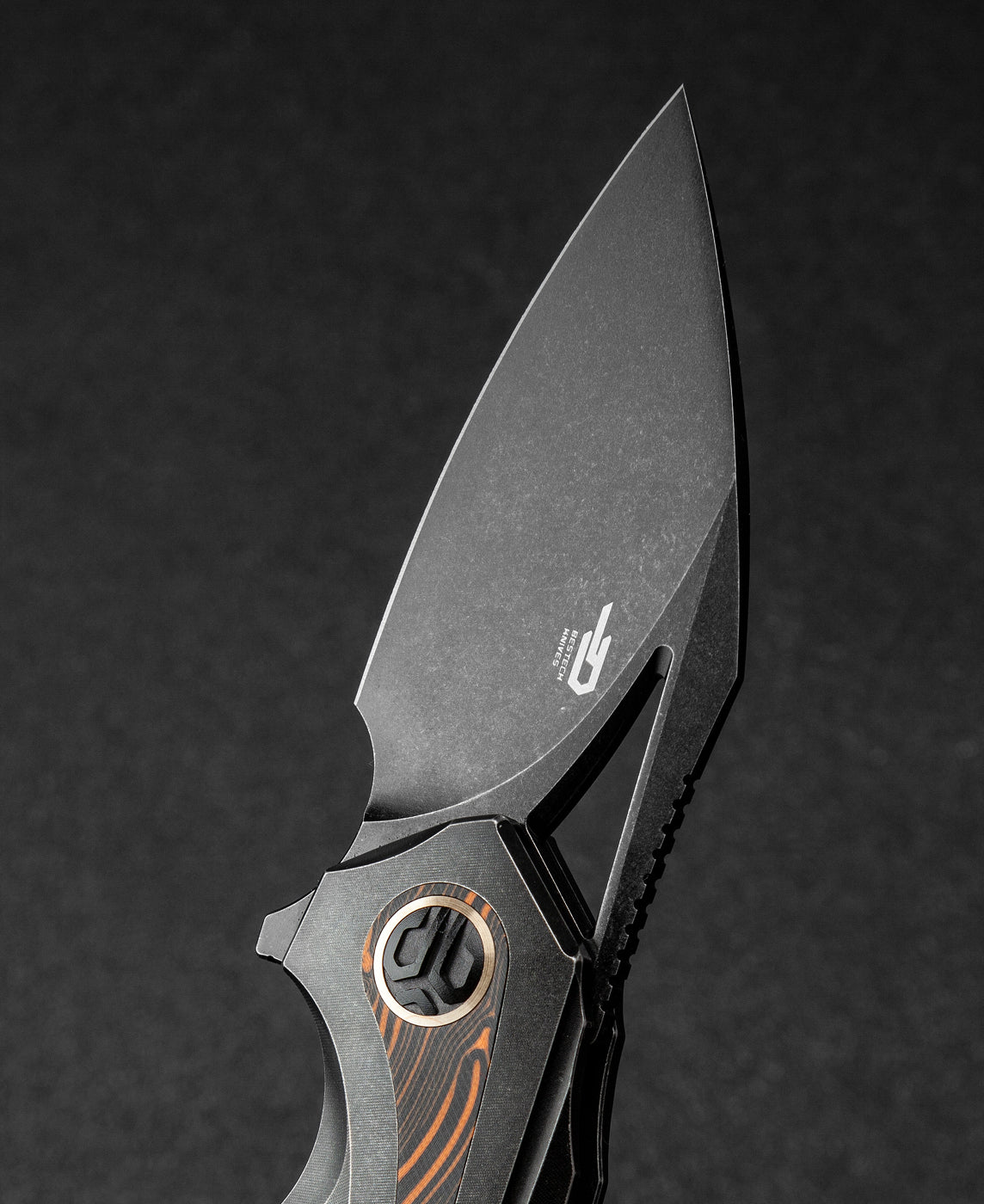 Bestech Nuke BT2107E orange G10 detail – high-contrast orange inlays on black titanium handle