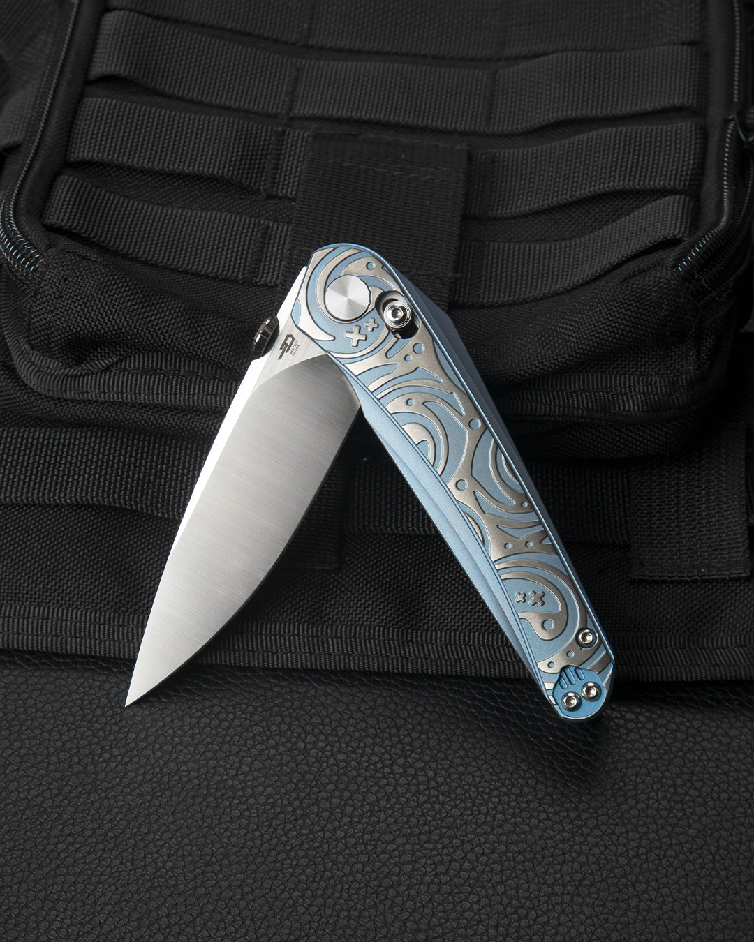 Bestech Mothus BT2206A blade detail – M390 satin finish blade by Kombou against blue titanium handle