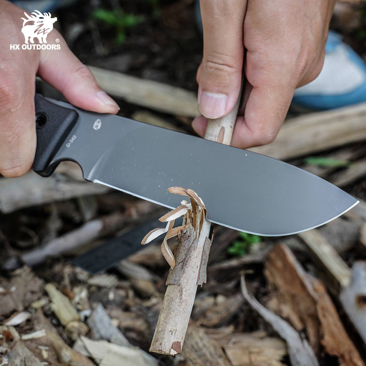HX Outdoors Rock Apex Pro D-342 gray titanium finish detail – carving wood in the field