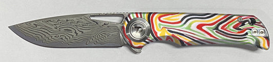 DreamTech Arcade D4384YR front view – 3.27" Damascus drop point folding knife with G10 handle and button lock