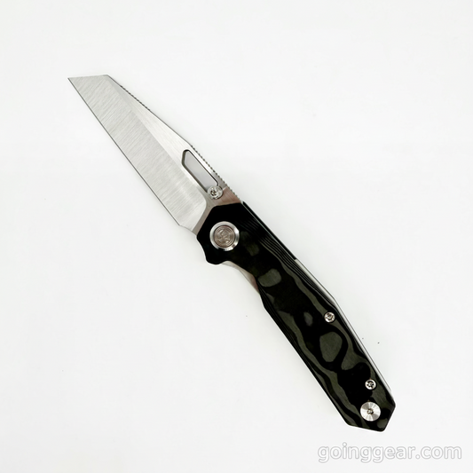 Divo Knives Small Boy open, showing the 3″ satin S90V reverse tanto blade and Black Pearl camo carbon fiber handle