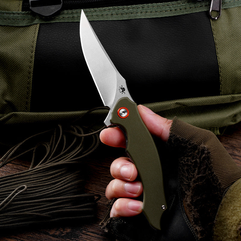 Klaken Corvus J307-GreenG10 open position in hand showing D2 drop point blade