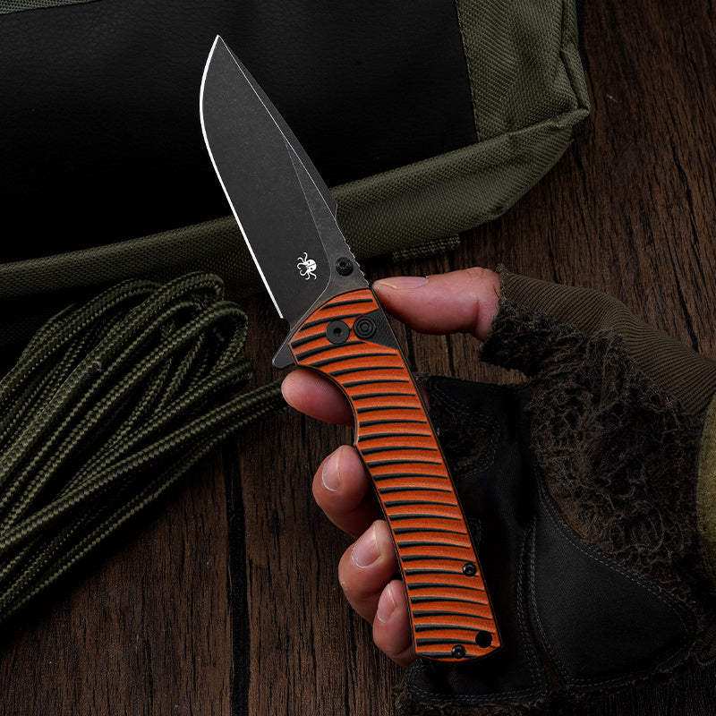 Klaken J394 Breakline J394-OrangeG10-BlackBlade open position showing black stonewashed D2 drop point blade