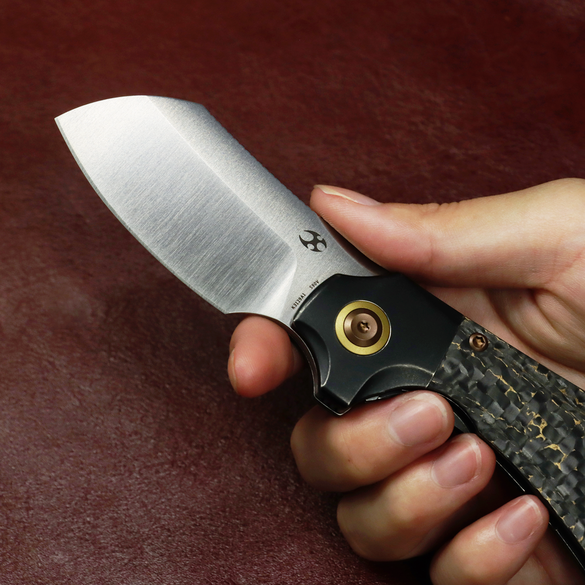 Kansept Pluto K3129A1 open position showing S90V drop point blade