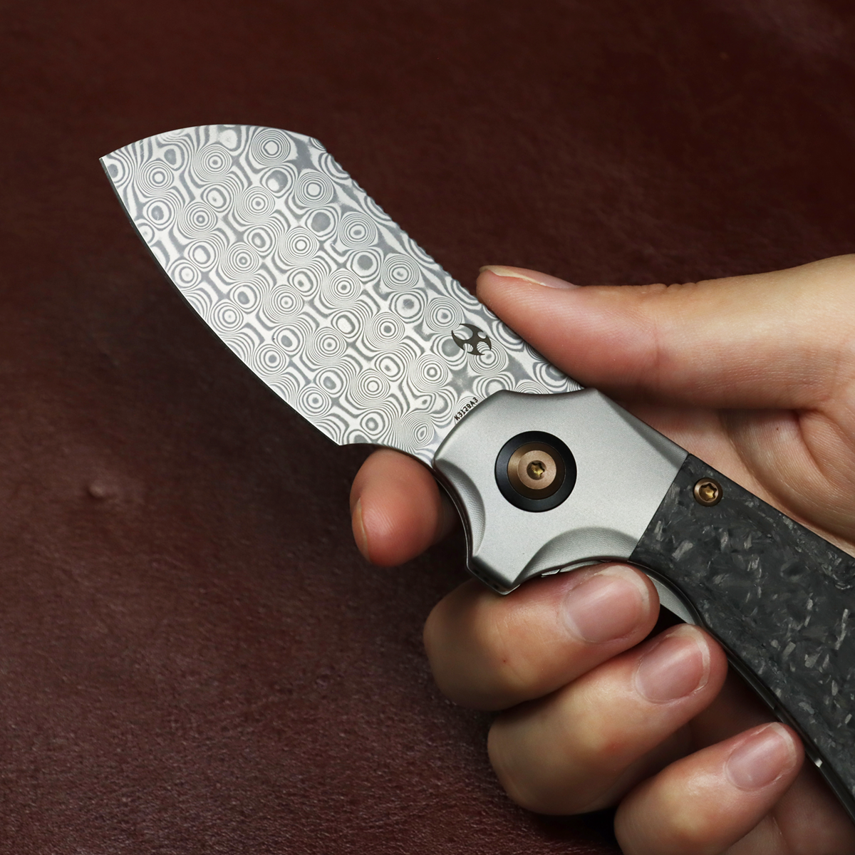 Kansept Pluto K3129A3 blade detail – acid etched Damascus drop point