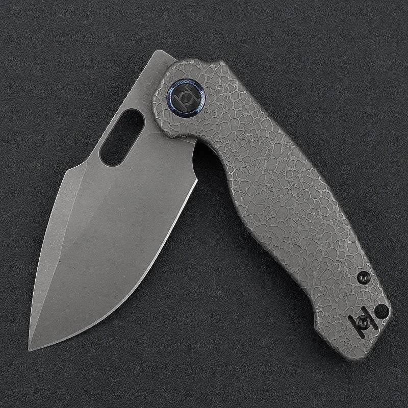 Kunwu Gringo K712T-1S open position showing stonewashed S390 blade