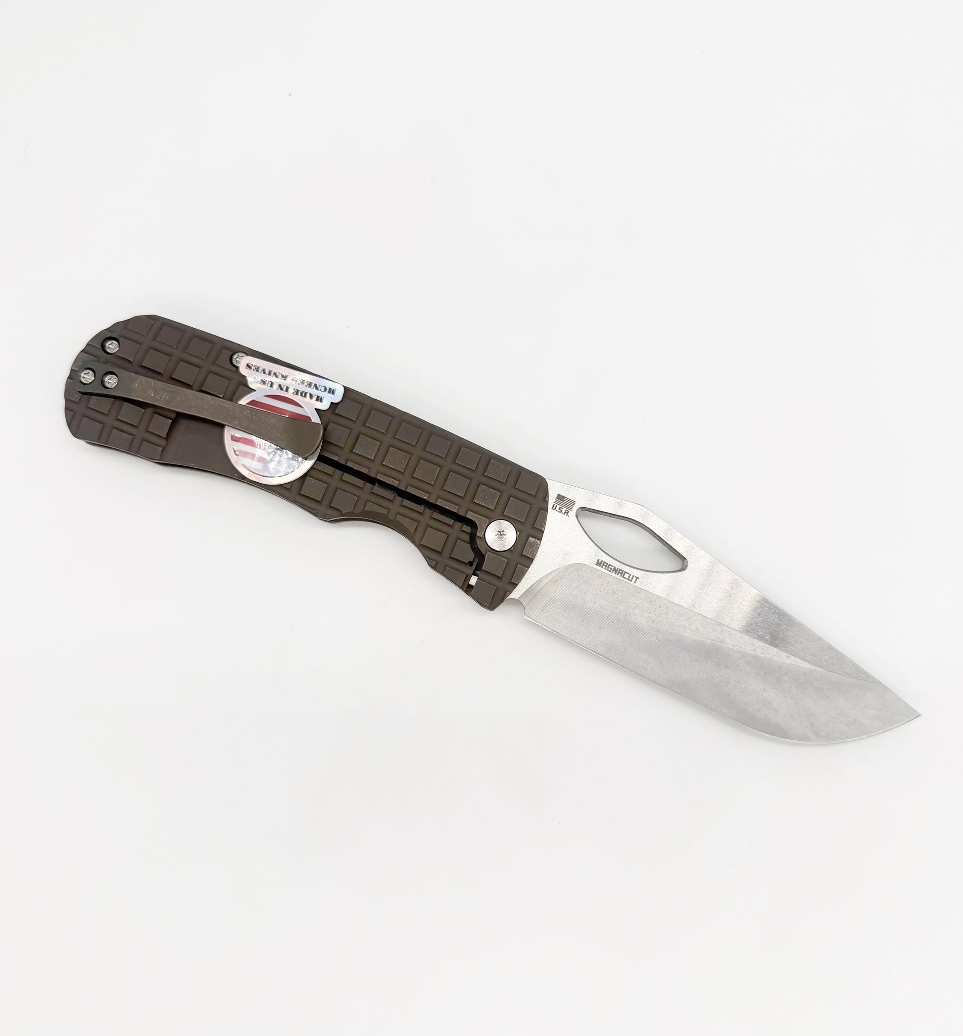 Close-up of McNees Knives Dixon 3.75 inch MagnaCut knife with bronze handle and satin blade