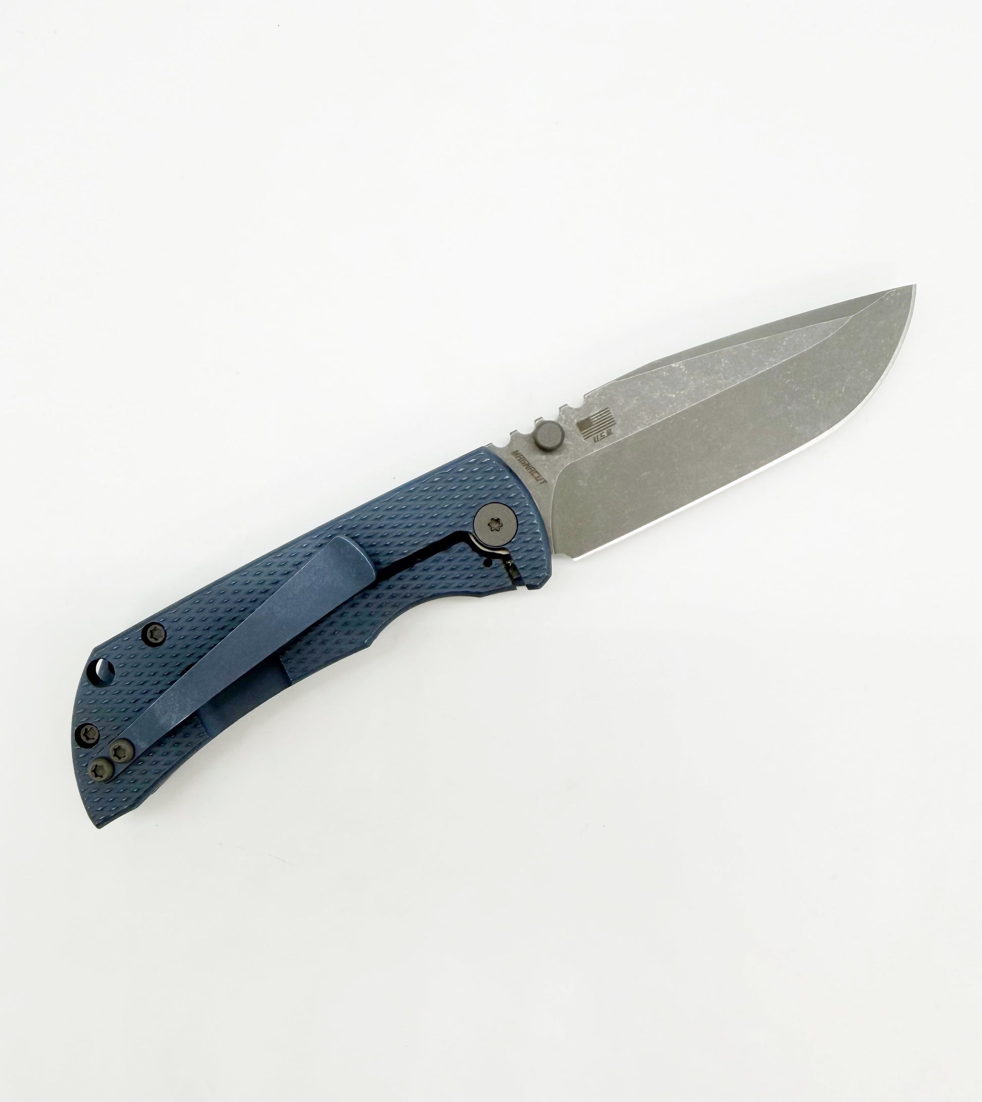 Close-up of blue titanium handle and partially open blade of folding knife