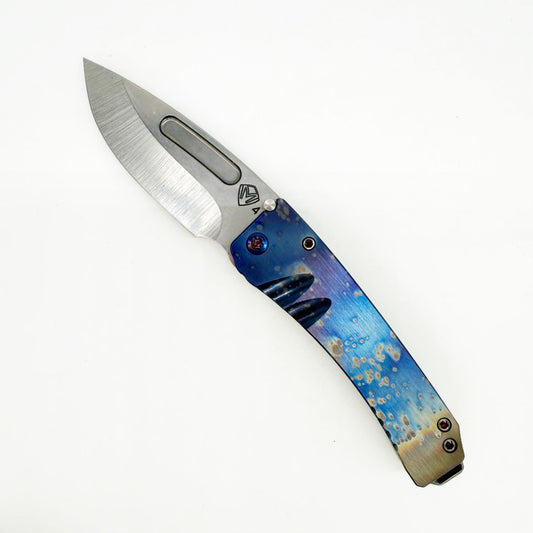 Medford Midi Marauder open, showing the 3.25″ tumbled S45VN drop point blade and brushed titanium Galaxy flamed handle