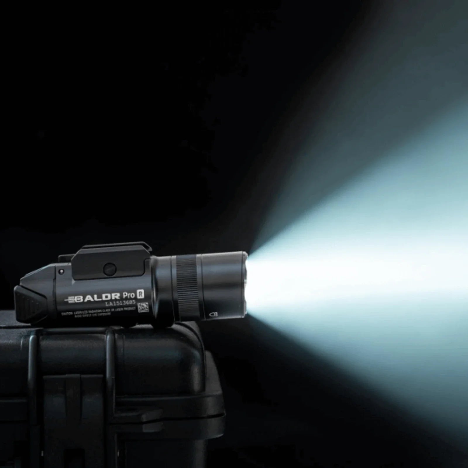 Olight Baldr Pro R Black projecting its 1,350 lumen white light beam