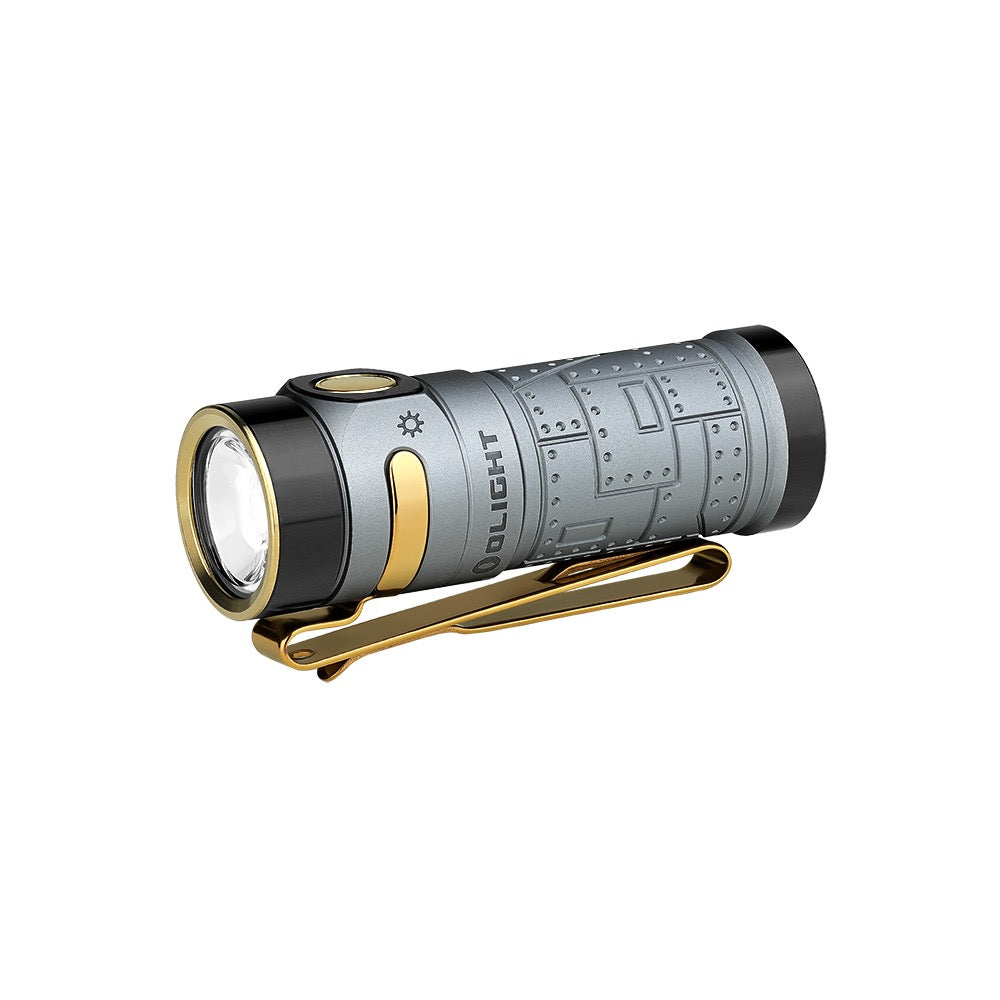 Olight Baton 4 Fighter Pilot angled view showing TIR lens, gold pocket clip and engraved body