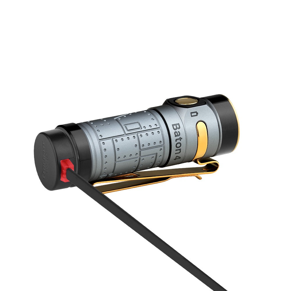 Olight Baton 4 Fighter Pilot with MCC magnetic charging cable attached to the tailcap