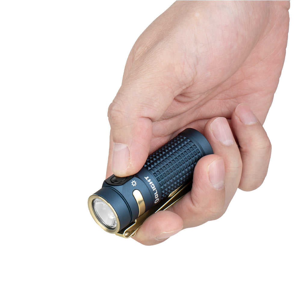 Olight Baton 4 Premium Guidance held in hand showing compact EDC pocket size and textured grip