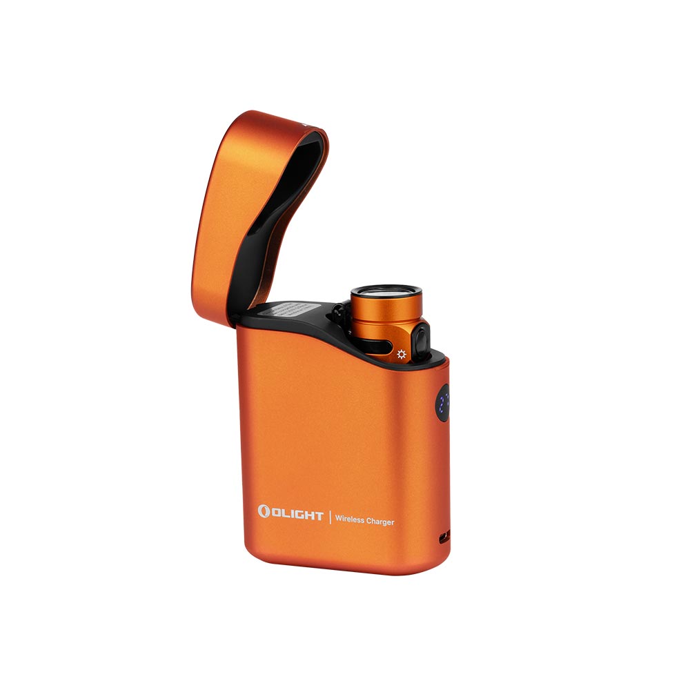 Olight Baton 4 Premium Orange flashlight seated in its open wireless charging case