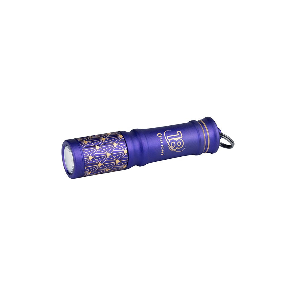 Olight i3E EOS 18th Anniversary Edition angled view – 90 lumen AAA keychain flashlight in purple
