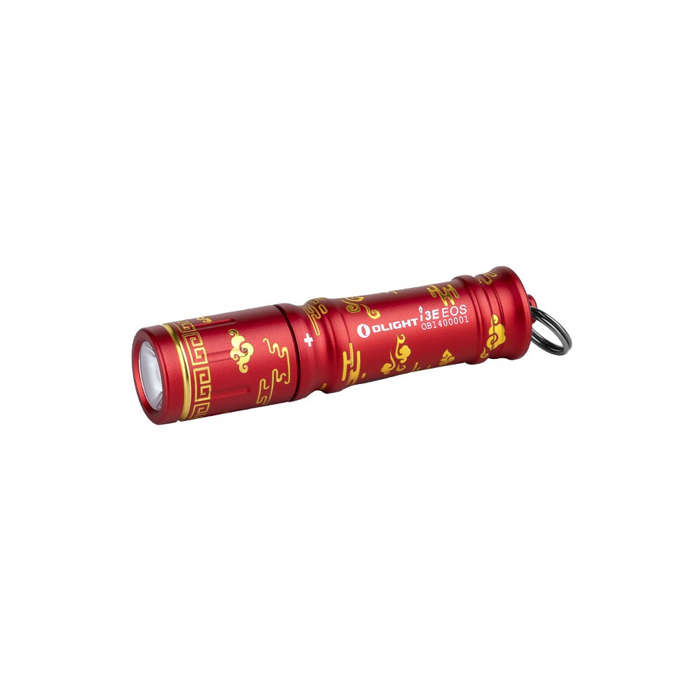 Olight i3E EOS Auspicious Clouds angled view – 90 lumen AAA keychain flashlight in red with engraved pattern