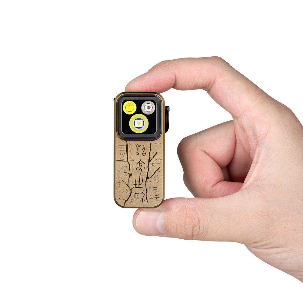 Olight Oclip Pro Ancient Script held between fingers showing its compact clip-on size
