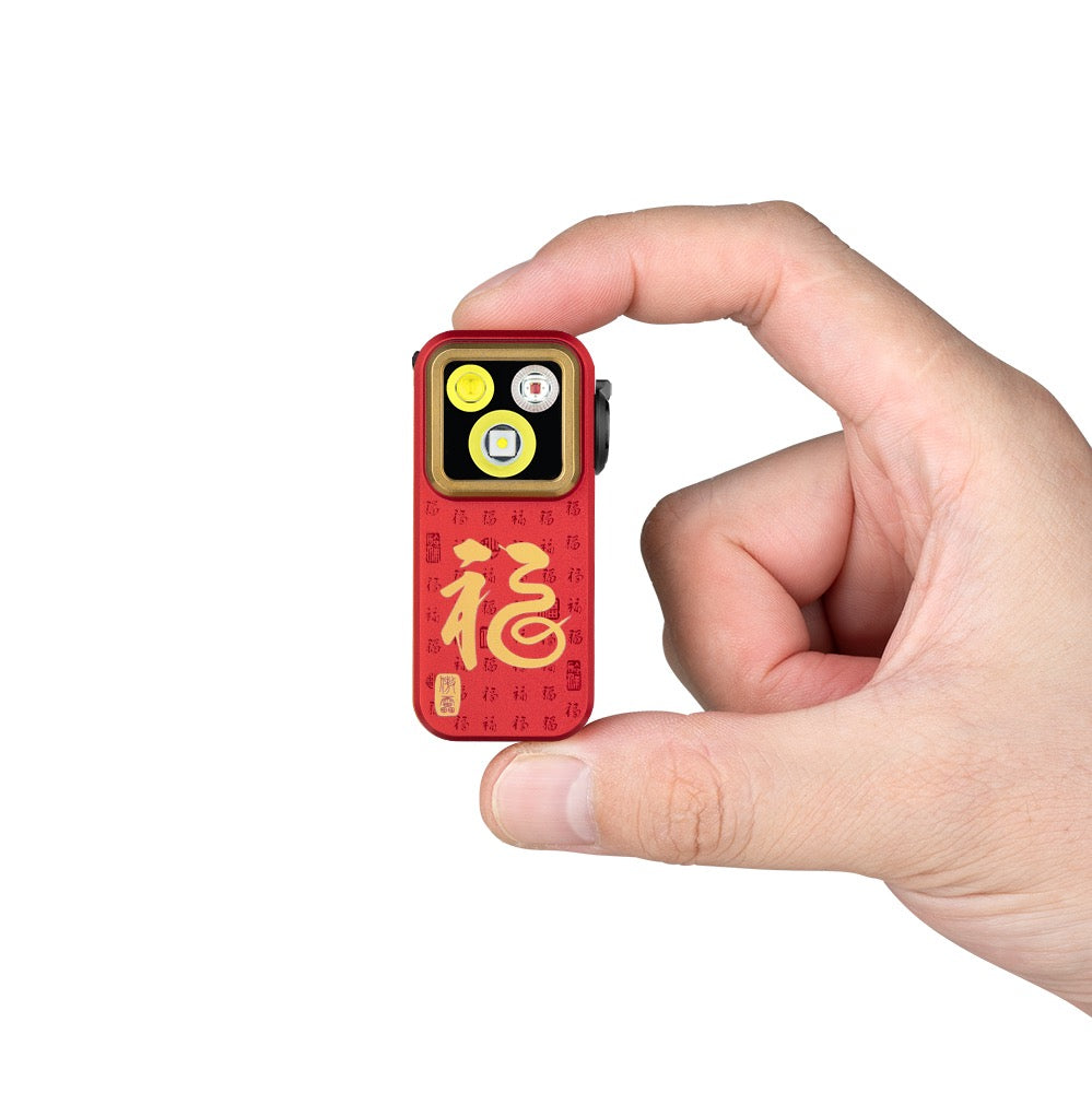 Olight Oclip Pro Fortune Snake held between fingers showing its compact clip-on size