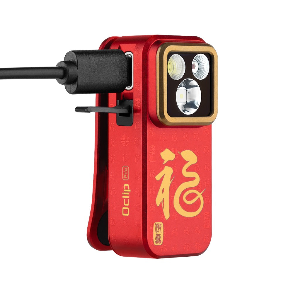 Olight Oclip Pro Fortune Snake charging via USB-C cable under the rugged port cover