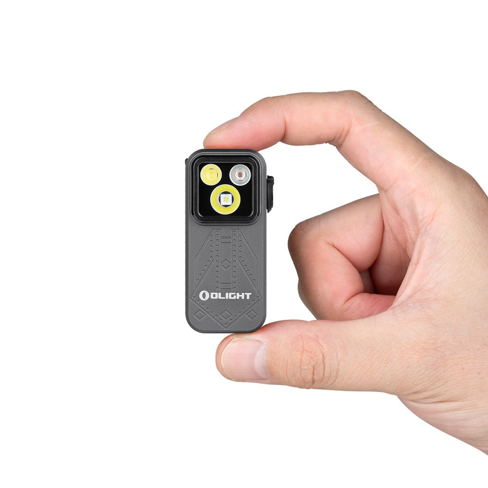 Olight Oclip Pro Phantom Squadron held between fingers showing its compact clip-on size