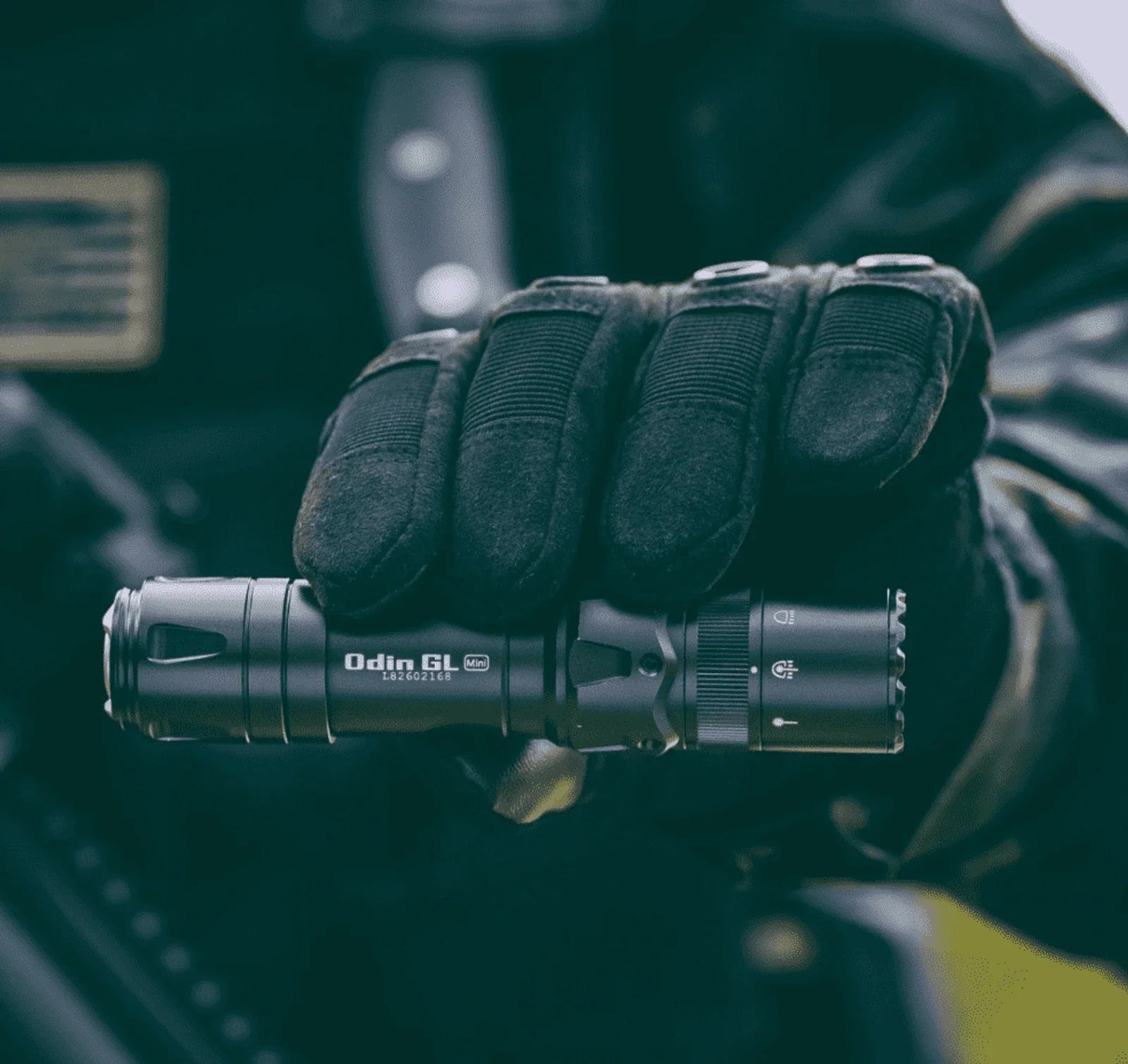 Olight Odin GL Mini magnetic charging cable connection at the tailcap