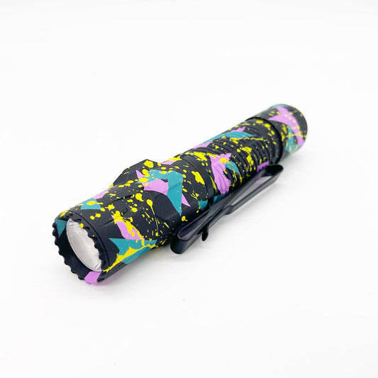 Olight Warrior Ultra Electric Splatter Cerakote front view – 2,500 lumen tactical flashlight
