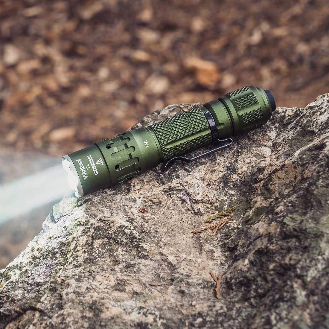 Weltool T2 TAC Black (T2 Tac Black) — held in hand EDC carry, 46,500 cd USB-C rechargeable flashlight
