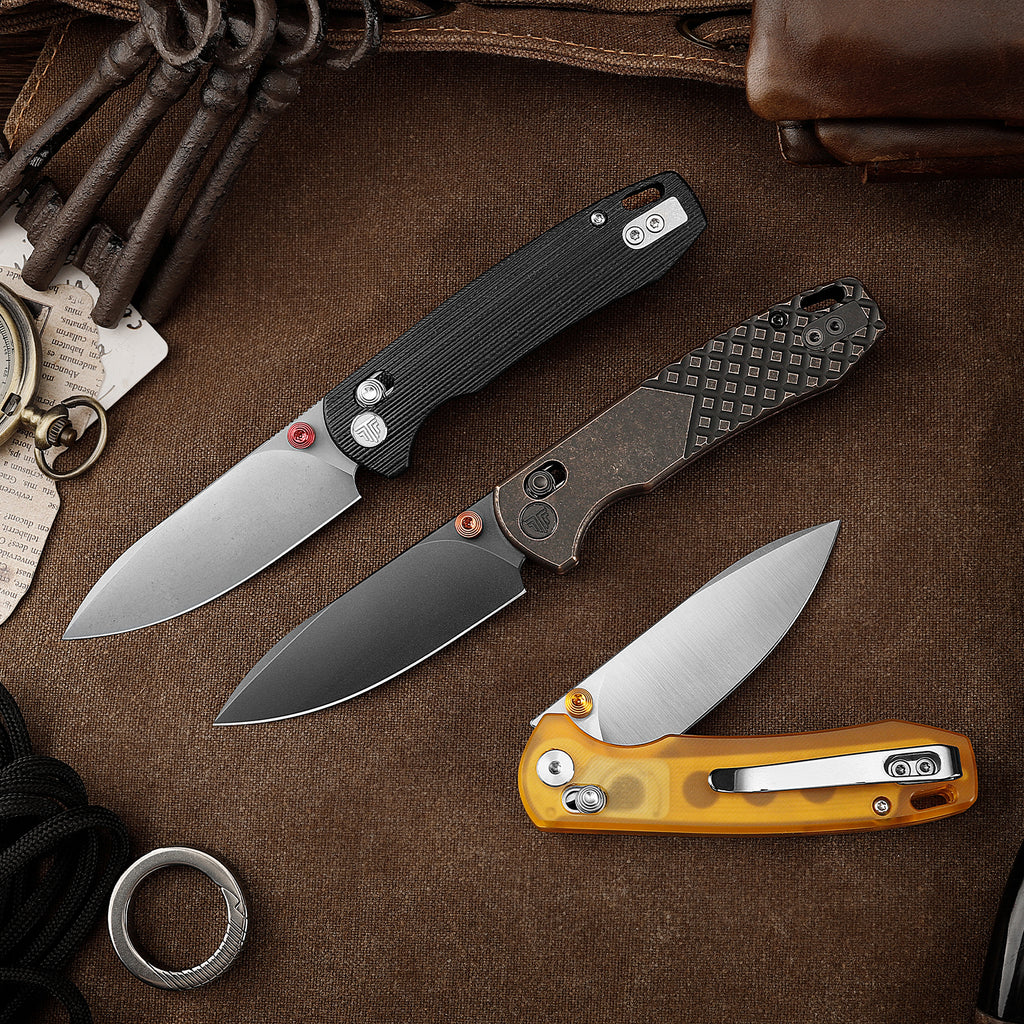 Collection of tactical knives including TRIVISA Dragonfly-CU JM03-CU-14 with black handle and drop point blade
